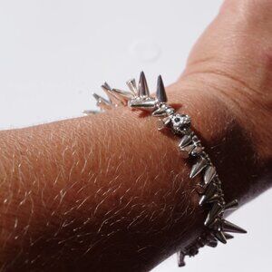 Women`s silver tone spikes stretch bracelet. 2 inc